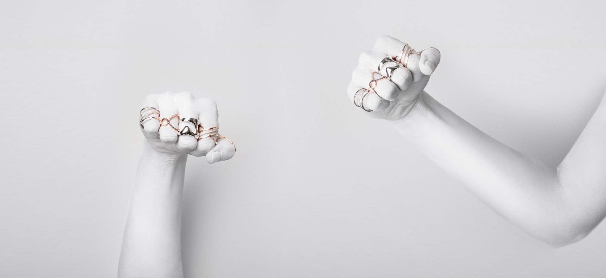 two hands with rings